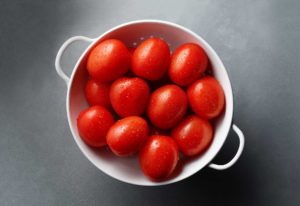 Brighthouse Organics Roma Tomatoes in colander